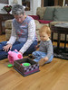 jasonandbecky > Friday night we headed to Manchester to see Great Aunt Pat and Great Uncle Richard.  Here Pat and Nick are playing with his new piggy bank toy.